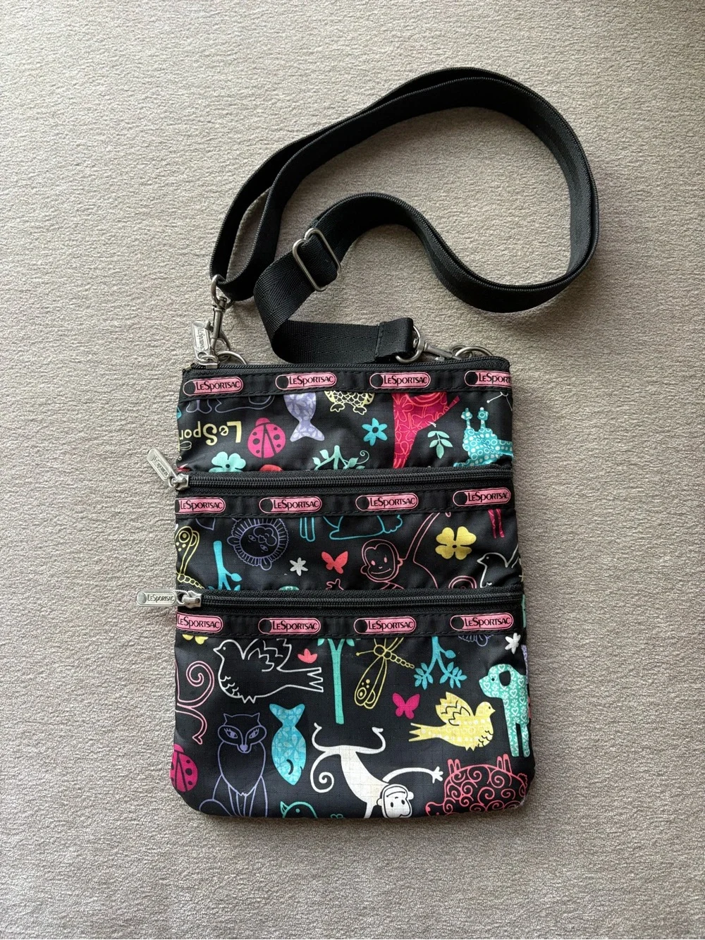LeSportsac Black Crossbody with Colorful Animal & Floral Print